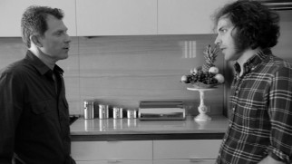 Celebrity chef Bobby Flay advises director Jonathan Krisel on how to master the marionberry pancakes shot in the mockumentary end to the "Brunch Village" director's cut.