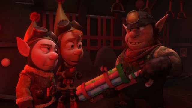 Noel shows off his wrapping paper gun to Wayne and Lanny.