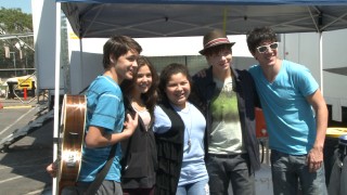Five young cast members pose coolly for a picture in "Putting on 'Prom.'"