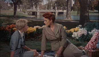 Posing as Sharon, Susan enjoys time with her mother (Maureen O'Hara) in an actual Boston park.