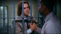 Prison bars are no match for a heartfelt handshake from Jerry Kellerman (Mark-Paul Gosselaar) in this shot from the Pilot episode.