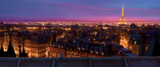 You can hardly see the little rat in this breathtaking rooftop shot of lit-up Paris at night.