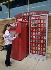 A young single woman might rent movies from a Redbox outside of Walgreens.