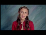 Jordan Pruitt sings "Outside Looking In" against a background familiar to anyone who's had their picture taken for school.