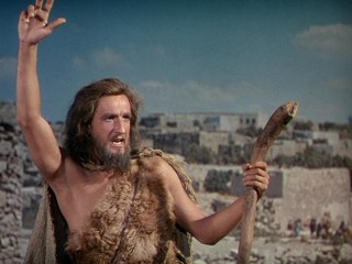 John the Baptist (Alan Badel) raises his hand. He knows the answer!