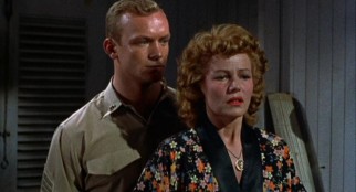 Phil (Aldo Ray) learns of Miss Sadie Thompson's past.