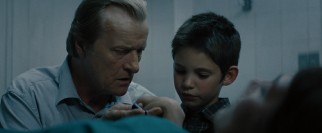 This flashback shows the disturbing mortuary existence in which Michael (Ben Cheetham) spent his youth with his father (Rutger Hauer).