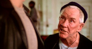 Though his lack of regard over the years has stung, Rocky can't say no to gym owner Mickey Goldmill (Burgess Meredith) training him for his title fight.