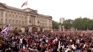 More than a few people gather outside Buckingham Palace hoping to witness in person the now customary post-wedding balcony wave.