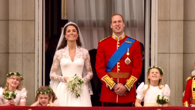 On the balcony of Buckingham Palace, Catherine Middleton and Prince William look up to admire the traditional aircraft fly-past, while young bridesmaid Grace Van Cutsem covers her ears in disgust.
