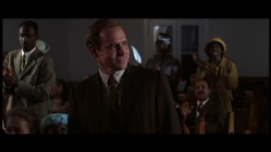 Coach Yoast and Sheryl (that's the top of her head) attend a predominantly black church in the deleted scene "Sunday Service."