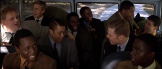 Brutal training camp leads to athletes of different races engaging in some back-of-the-bus song.