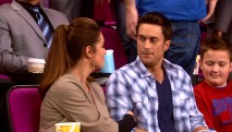 Even on her birthday, Adam (Oliver Hudson) finds it tough to pay attention to Jen while setting next to a boy (Noah Munck) with a handheld video game.