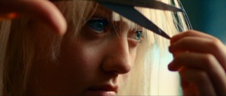 Fifteen-year-old Cherie Currie (Dakota Fanning) gives her bangs an uneven trim for a talent show makeover.