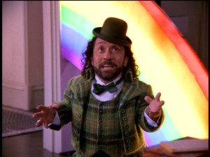 Seeing as there are no bonus features and the menus aren't especially exciting, here's another screencapped moment from Season 3. Other Realm dwarf Roland (Phil Fondacaro) shows up twice in Season 3, once as a detective and here as a leprechaun in front of a rainbow.