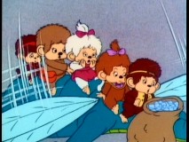Monchhichis take to the air, with help from a dragon wasp. Monchhichi means happiness, mon.