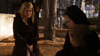 Two worlds, one family: Sarah Cain consoles one of the young'uns of her five Amish wards.