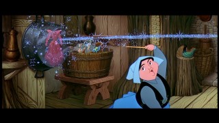 Merryweather does an over-the-shoulders, off-the-pot move to make Flora's dress her beloved blue. Believe it or not, fussing over colors is the act with dire consequences. Cap from 2003 Special Edition - click to view in 720 x 480.