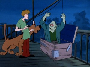 Shaggy and Scooby-Doo get spooked by a zombie, one of a deserted town's two feared residents in the disc's first episode.