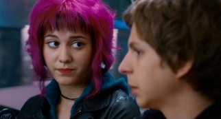 On a shared bus ride, magenta-haired Ramona (Mary Elizabeth Winstead) explains Scott's predicament of having to fight and defeat her seven evil exes.