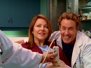 There's scheming behind the smile of Jordan Sullivan (Christa Miller), as she decides to keep Dr. Cox from learning the sex of their second child at the Ultrasound.