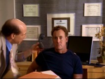 As his new office bustles with activity, Dr. Cox sits fairly still adapting to his new role.