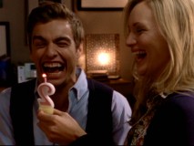 Cole (Dave Franco) and Lucy (Kerry Bish) are highly amused by a trick candle.