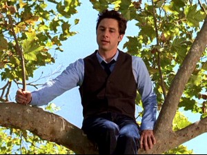 Perched in a tree for an outdoor class, J.D. (Zach Braff) peppers his lesson with botanical puns.