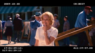 Penny bids goodbye to her family with a finger over her smile, as John Malkovich approaches in this deleted scene, the DVD's longest.