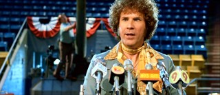 Jackie Moon rocks the neckerchief at the press conference in which he announces the Tropics' Mega Bowl.