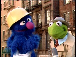 Kermit the Frog wants construction worker Grover to tell him how to get, how to get to Sesame Street.
