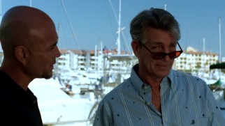 As the morally ambiguous plain clothes genetic scientist Nathan Sands, a sunglassed Eric Roberts naturally claims the film's "And" credit.