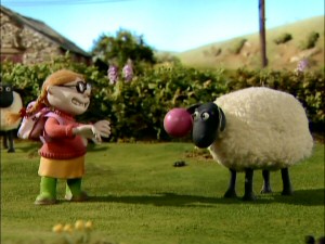 The farmer's reckless niece amuses herself by throwing a ball at a sheep's face.