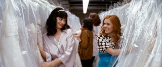 Of course best friends Suze (Krysten Ritter) and Becky (Isla Fisher) are going to be giddy whilst shopping for a wedding dress. Would you expect anything else from ditzy chick flick chicks?