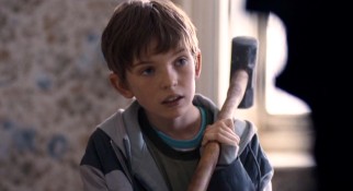 Michael (Bill Milner) picks up a sledgehammer to pitch in with the many renovations his family's new home needs.