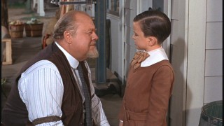 Osh (Burl Ives) has a talk with Peter, who's suspiciously sporting a new 'do.