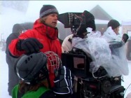 Director Robert Vince checks a shot while inadvertently patting Dominic Scott Kay on the head in the disc's "Dogumentary."