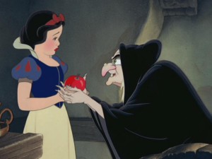 The Queen, disguised as an old peddler woman, hands Snow White the apple of Snow's impending doom.