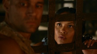 The ludus cell bars aren't enough to keep slave girl Naevia (Lesley-Ann Brandt) away from Crixus (Manu Bennett), Capua's feared and coveted champion.