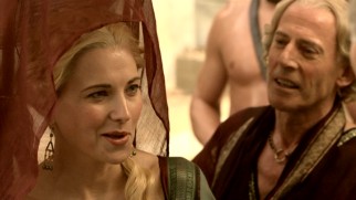 Lucretia (Lucy Lawless) gladly refuses an offer by Solonius (Craig Walsh-Wrightson) to buy a necklace from her for her.