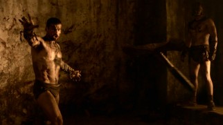 Anything goes in the Pits of the Underworld, as Spartacus (Andy Whitfield) throws his weapon at a malicious, inattentive spectator. In slow motion, of course.