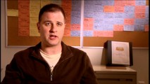 Developer/writer/producer/story editor Greg Weisman talks about "Stylizing Spidey" in front of a wall full of color-coordinated story ideas.