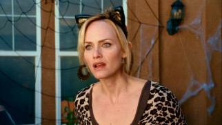 Meow! The children's mother Gillian (Amber Valletta) is a kitty cat woman in the film's Halloween-set climax.