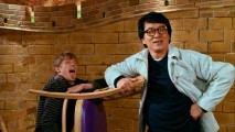 Jackie Chan poses with a chair and a co-star (Lucas Till) in the blooper reel. The same shot's appearance at the start of the end credits displays the film's title logo.