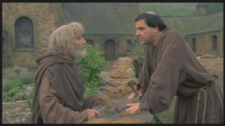 Brother Daniel (Mandy Patinkin, right) insists that Brother Paul allow Squanto to stay with the monks.