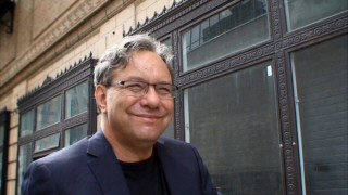 Lewis Black's concert film, "Stark Raving Black", opens with a few fleeting shots of the famed comedian walking the streets of Detroit.