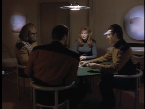 Worf, Dr. Crusher, Data, and Riker sit down for a repetitive poker game in "Cause and Effect."