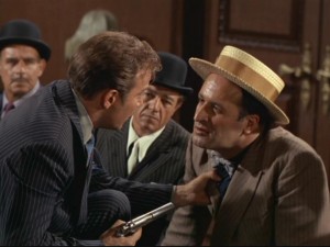 Kirk gets into the gangster spirit as he holds crime boss Jojo Krakow (Vic Tayback) by the tie at gunpoint in "A Piece of the Action."