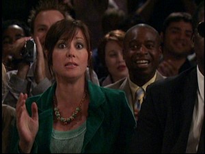 The twins' mother Carey Martin (Kim Rhodes) and hotel manager Mr. Moseby (Phill Lewis) are among the shocked audience members doling out applause to the gang's High School Musical stage show.
