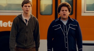 Best friends and social outcasts Evan (Michael Cera) and Seth (Jonah Hill) strut their stuff upon exiting a city bus.